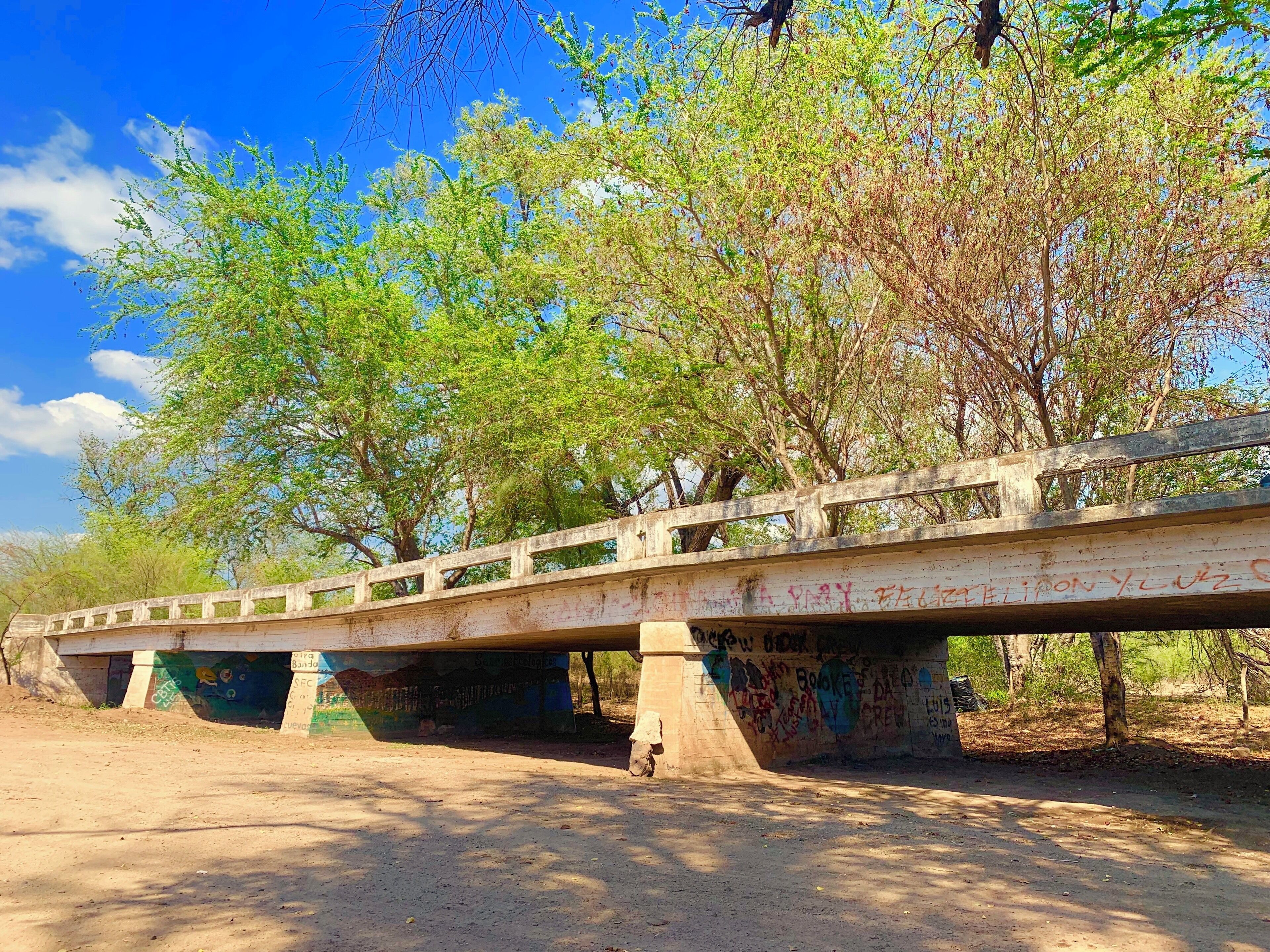 Near the old bridge you can find another street vendor that sells the most delicious bread. Here’s a great local place to drink with tour friends, that’s why it is filled with street art. #streetart #old #bridge #abandoned