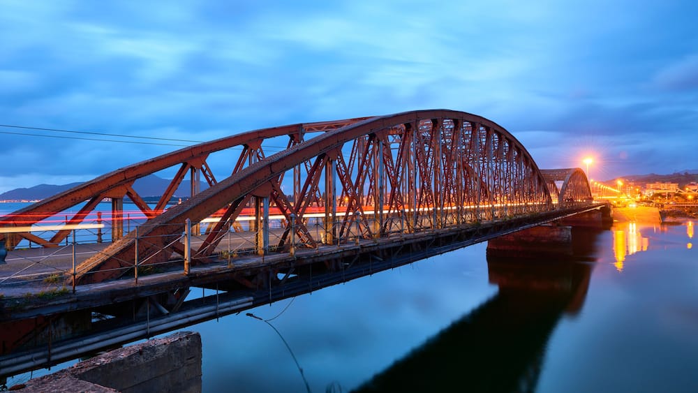 Iron Bridge over the Ason river at evening, Colindres, Cantabria, Spain