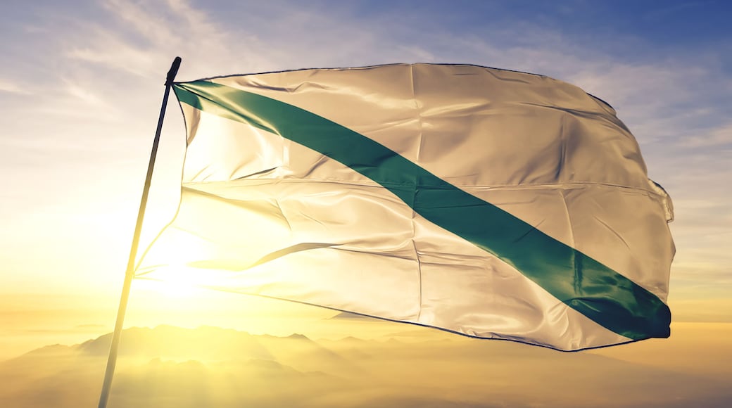 Quevedo of Ecuador flag waving on the top sunrise mist fog