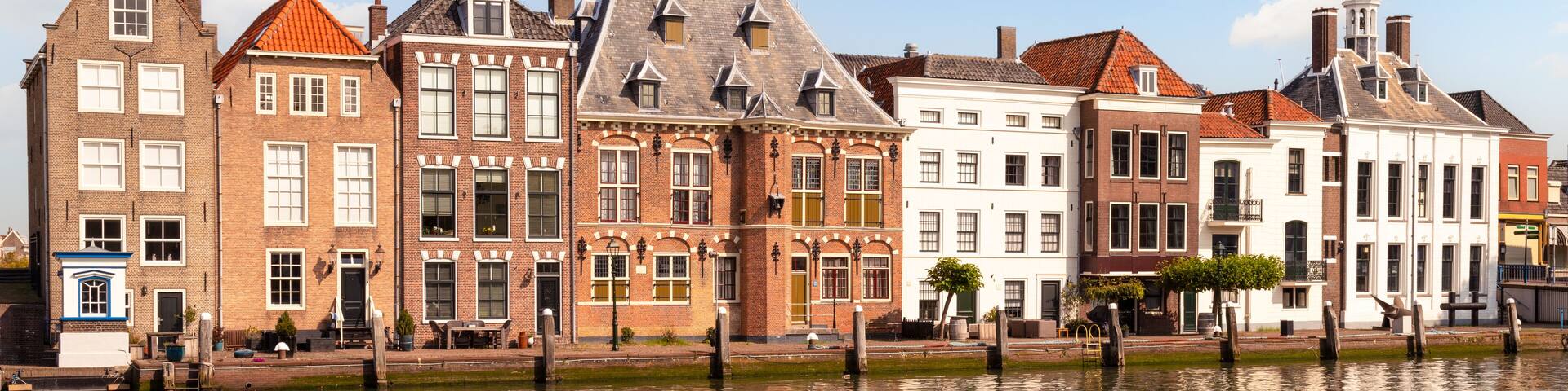 Canal houses along the quay of the old harbor in Maassluis in the Netherlands.