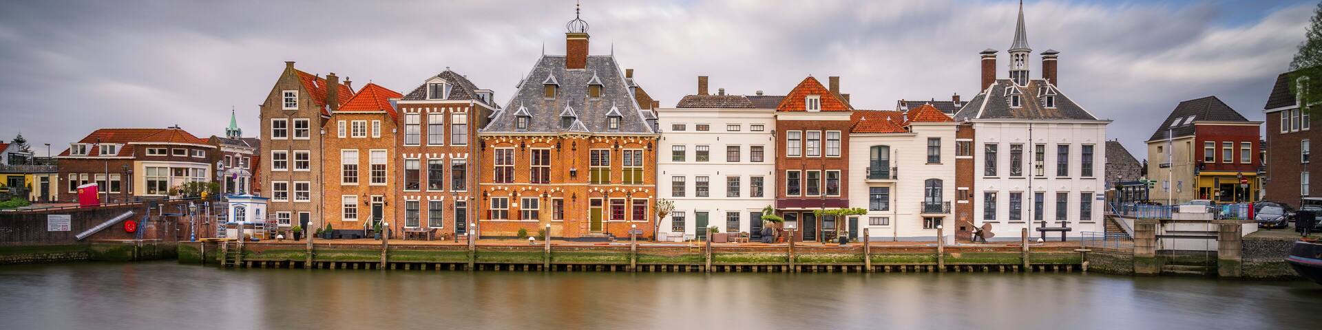 A canal with historic buildings on one side.
