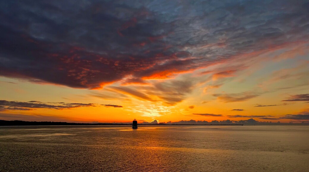 Sunrise from the pier in Tayport Fife Scotland, The Tayport pile lighthouse known as the "East Lighthouse" is one of only three surviving Pile Lighthouses in the United Kingdom.