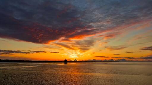 Sunrise from the pier in Tayport Fife Scotland, The Tayport pile lighthouse known as the "East Lighthouse" is one of only three surviving Pile Lighthouses in the United Kingdom.