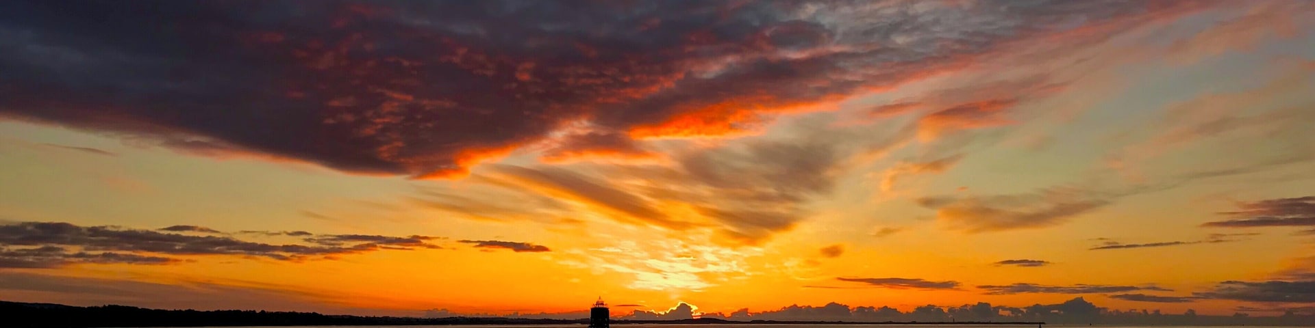 Sunrise from the pier in Tayport Fife Scotland, The Tayport pile lighthouse known as the "East Lighthouse" is one of only three surviving Pile Lighthouses in the United Kingdom.