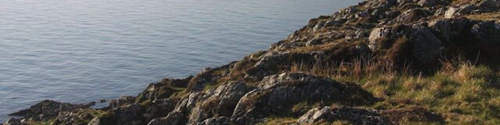 View from southern tip of Gigha Looking back across Gròb Bàgh from the highest point on Gigha's southern tip. In the distance the Paps of Jura can just be seen.