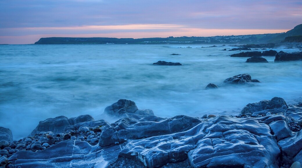 At sunset, looking towards Port Eynon on the Gower Peninsular near Swansea in Wales. The mix of colours may appear calming but the reality was something quite different. The incoming tide in this area is ferocious.
