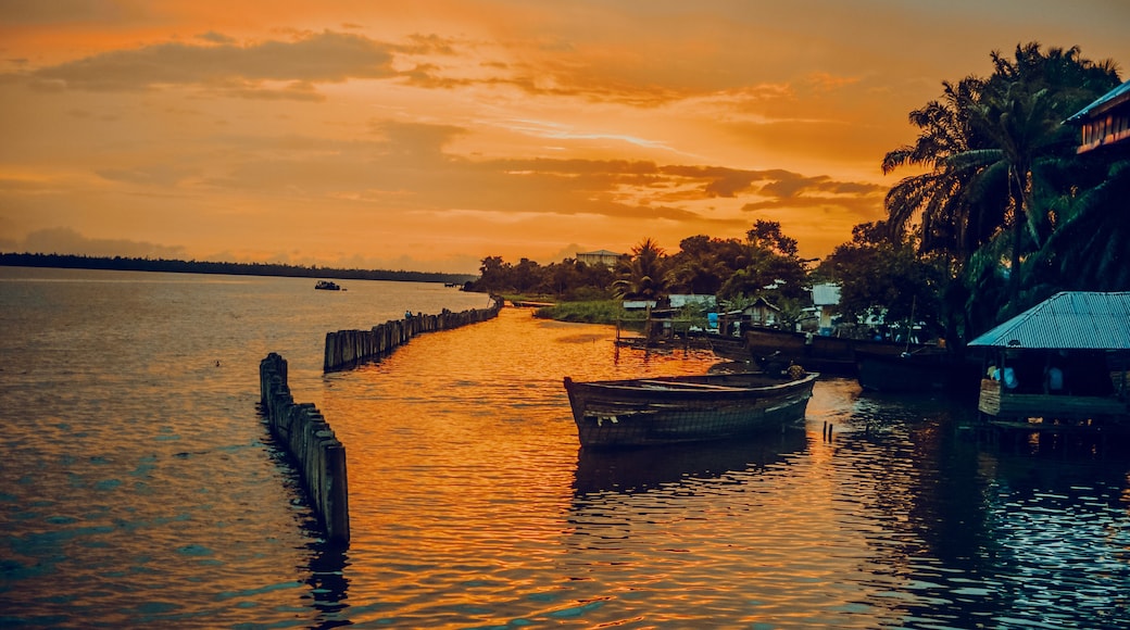 Nigeria, Delta State, Koko river and fishing village at sunset