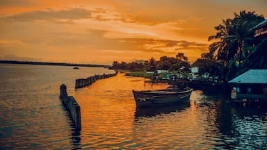 Nigeria, Delta State, Koko river and fishing village at sunset