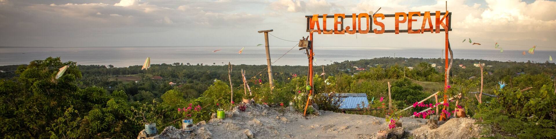 Scenic view of Alejo's Peak park with a sign in Bogo, Cebu, Philippines