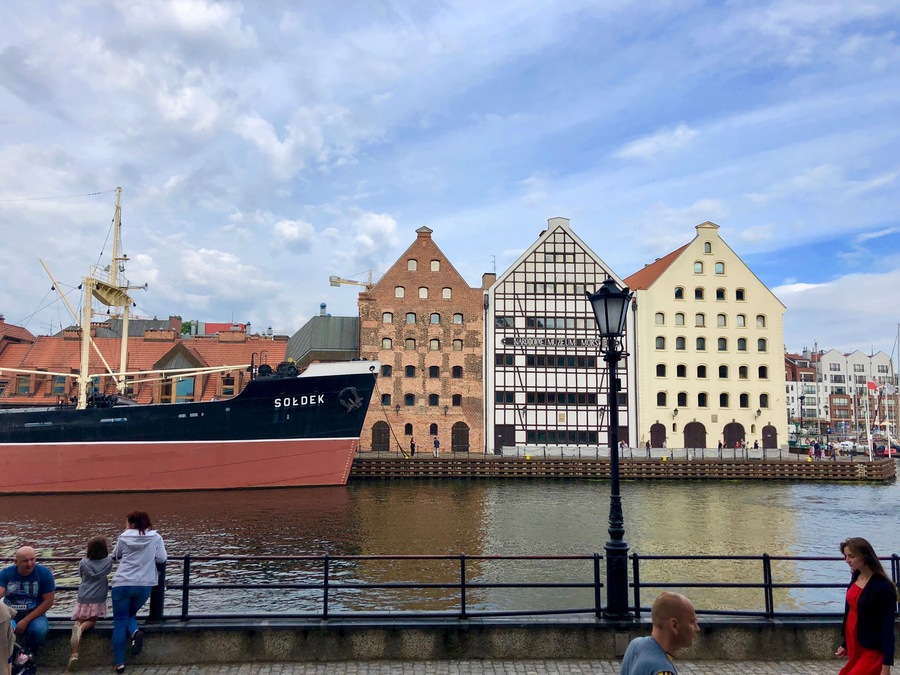 Beautiful street by the water in Gdansk, lined with boutique hotels and alleyways to incredible restaurants.