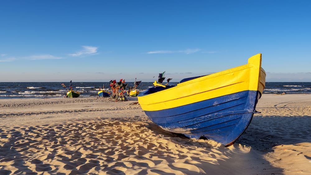 Traditional fishing boat on sandy beach in Jantar village. Baltic sea, Poland.; Shutterstock ID 587834471