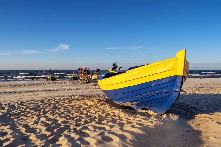 Traditional fishing boat on sandy beach in Jantar village. Baltic sea, Poland.; Shutterstock ID 587834471