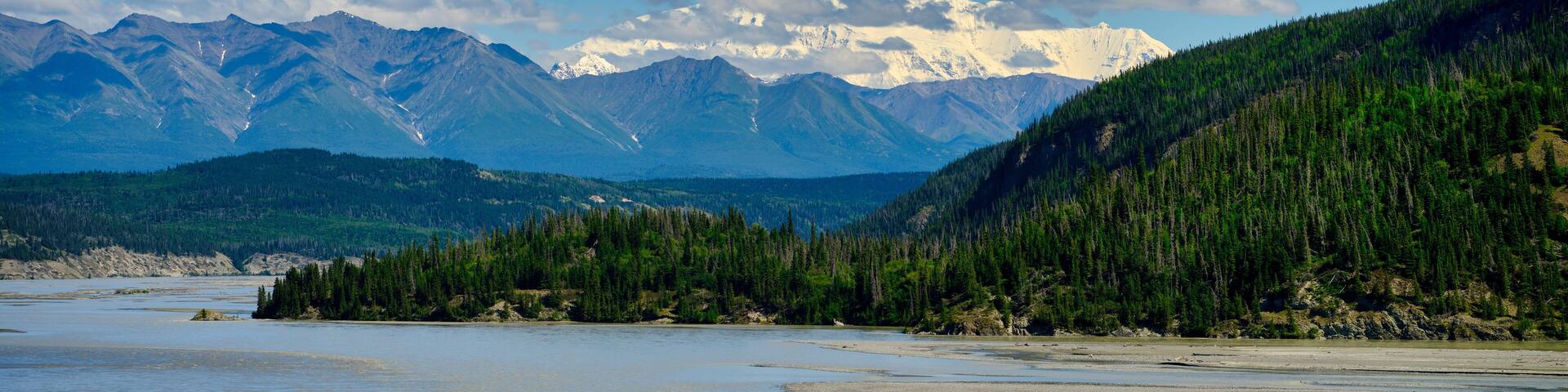 Snow covered mountains of the Wrangell-St Elias mountain range as the background to the Copper River near Chitina Alaska