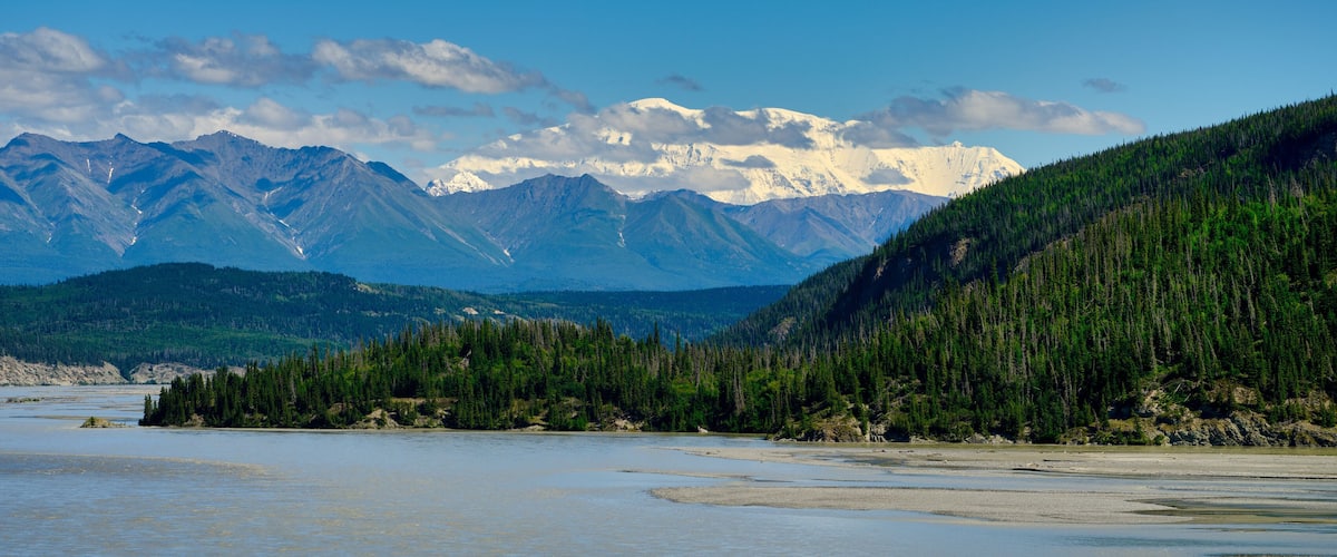 A river with mountains in the background.