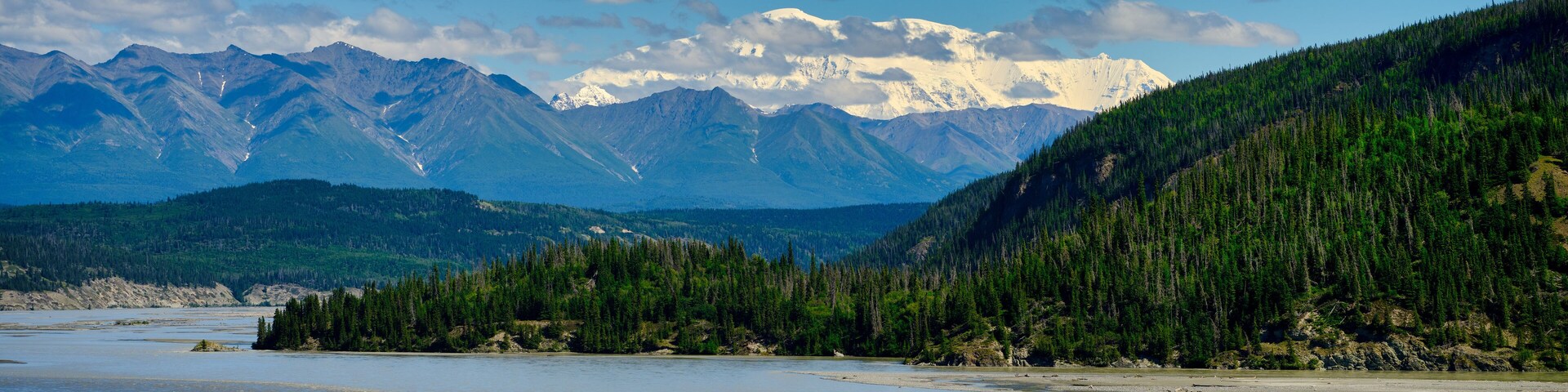 A river with mountains in the background.