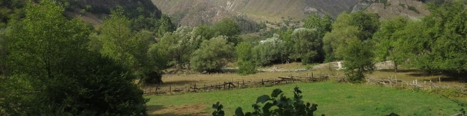 View of the countryside between Bakuriani and Borjomi, Georgia.
If you look closely, you'll notice the fire damage at the top of the mountain. In 2008, there was a brief war between Russia and Georgia over two, long disputed regions in Georgia.
During the course of the war, the Russians launched airstrikes against a supposed military bunker used by the Georgian government in this area. These bombings accidentally resulted in a large forest fire that burned a significant amount of forest land - and greatly pissed off the Georgian people.