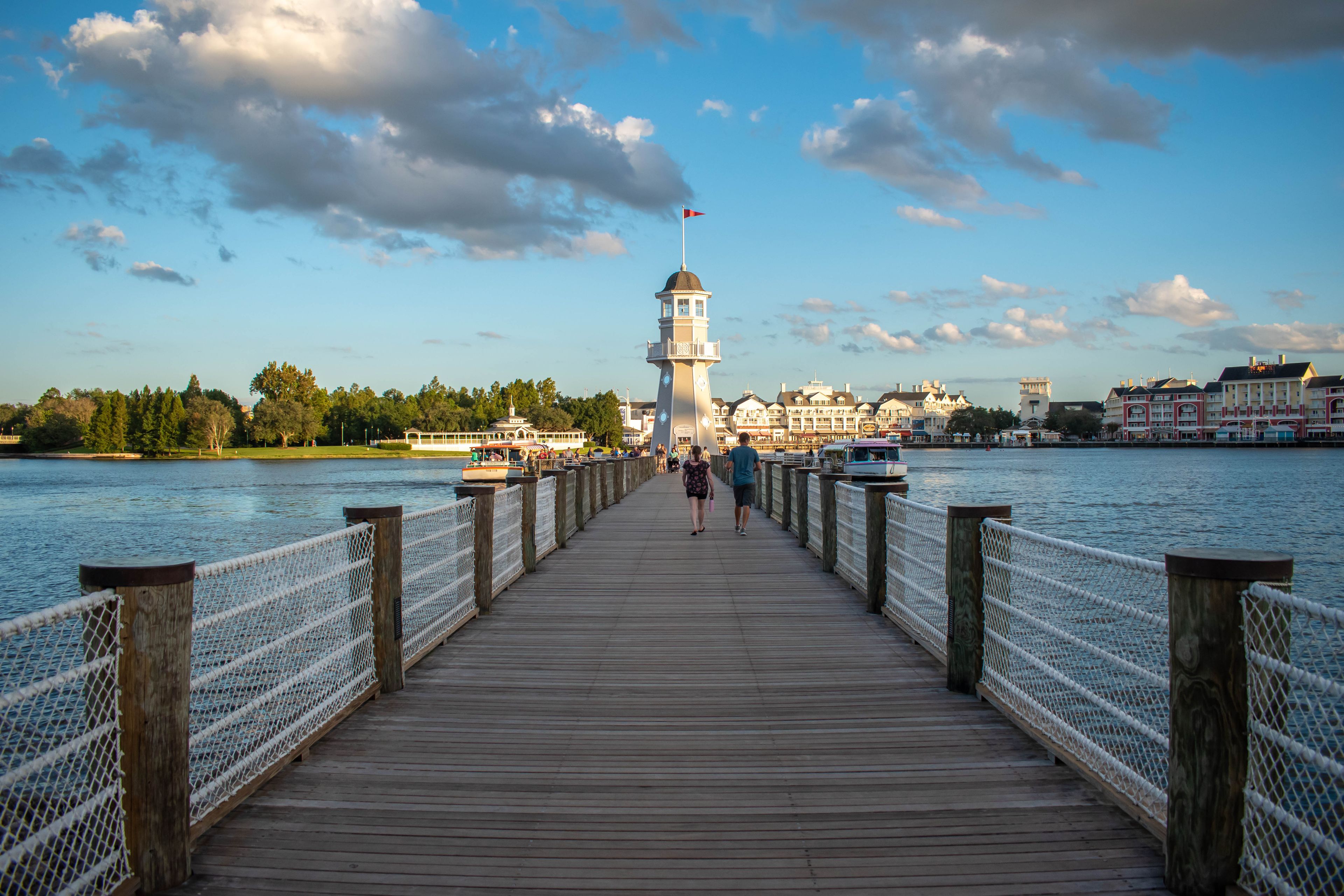 Orlando, Florida. October 11, 2019. People walking on pier on the way to lighthouse at Lake Buena Vista 89