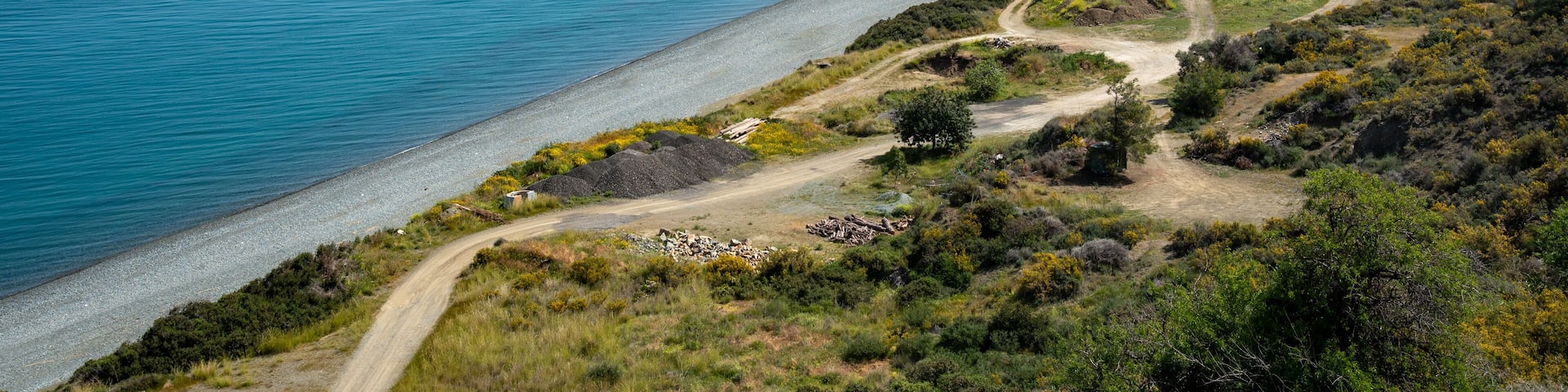 Long beach meeting blue sea under blue sky on sunny day