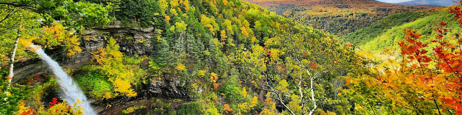 A scenic autumn view of Kaaterskill Falls in the Catskill Mountains of New York.