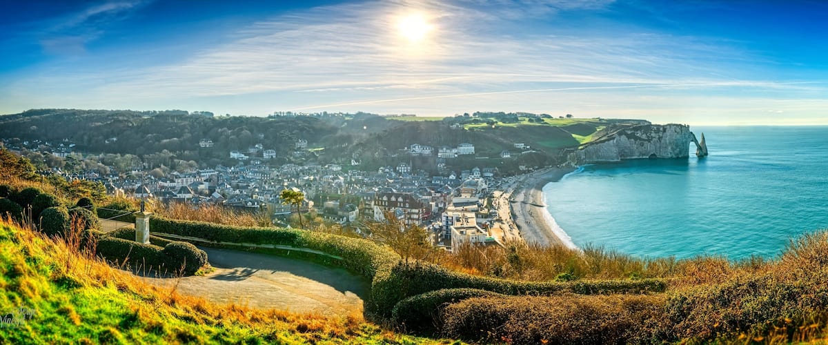 A coastal town with a cliff and a beach.
