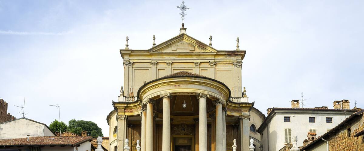 A grand building with classical architecture, featuring a central dome, columns, and a staircase leading up to it.