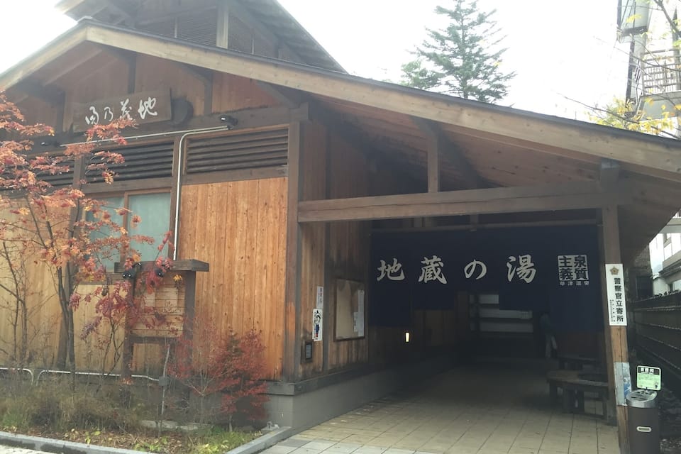 A wooden building with signage in Japanese.