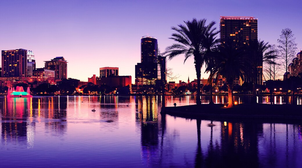 Orlando downtown skyline panorama silhouette over Lake Eola at dusk with urban skyscrapers