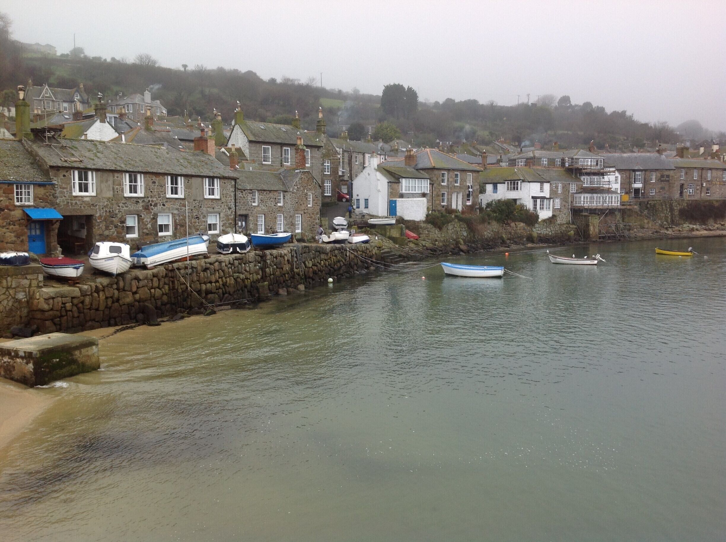 Little village on the south west of England. The road around the village are so tight against the old buildings that it literally feels like you have entered a mouse hole. It eventually opens up to this amazing fishing village cove. Fantastic chance discovery not well known.