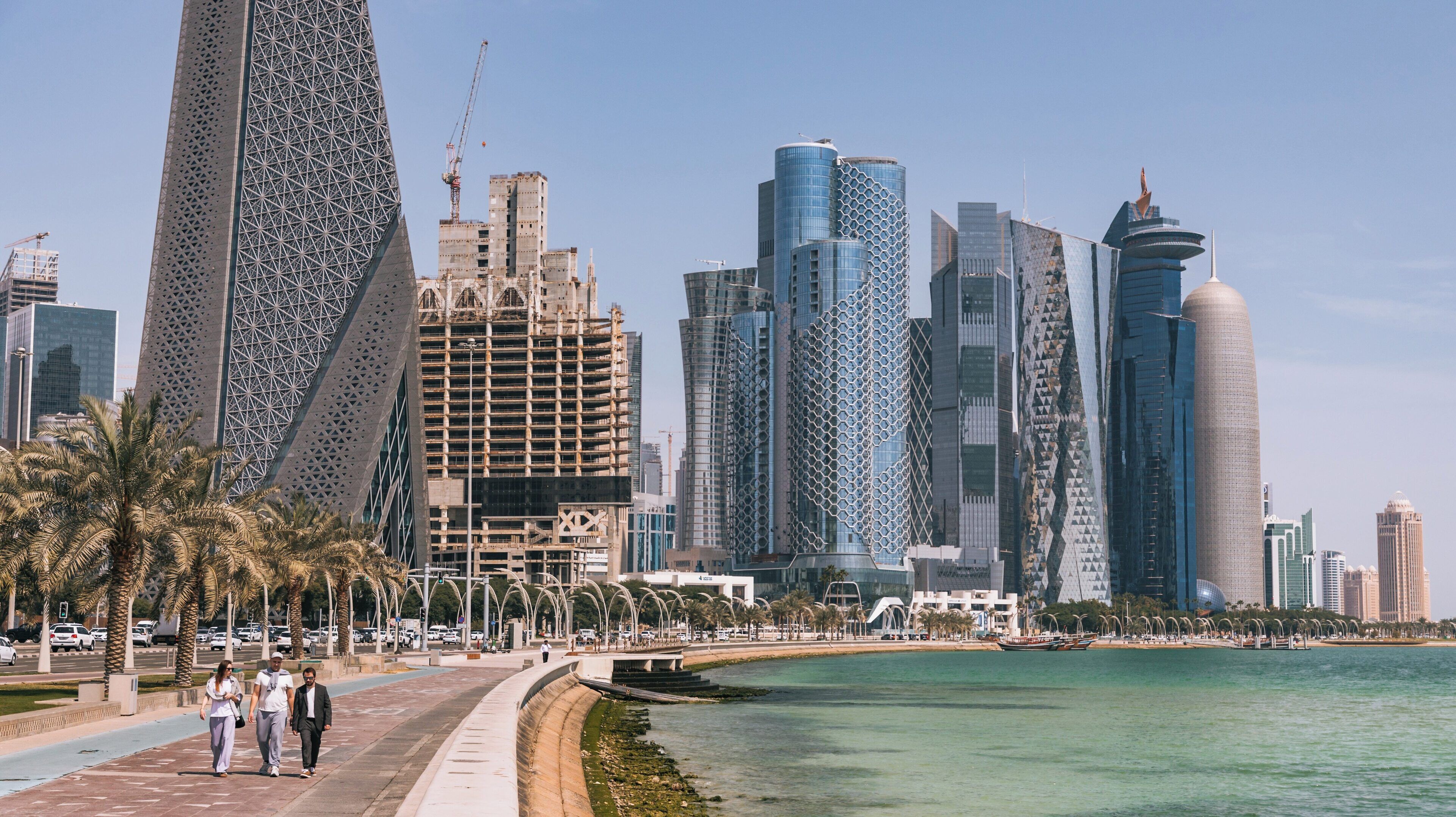 Strolling along Doha Corniche in the Diplomatic Area, showcasing modern skyscrapers and coastal views in Qatar