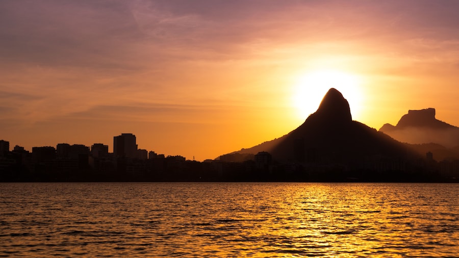 View of Rio de Janeiro Sunset Behind Mountains at the Lake