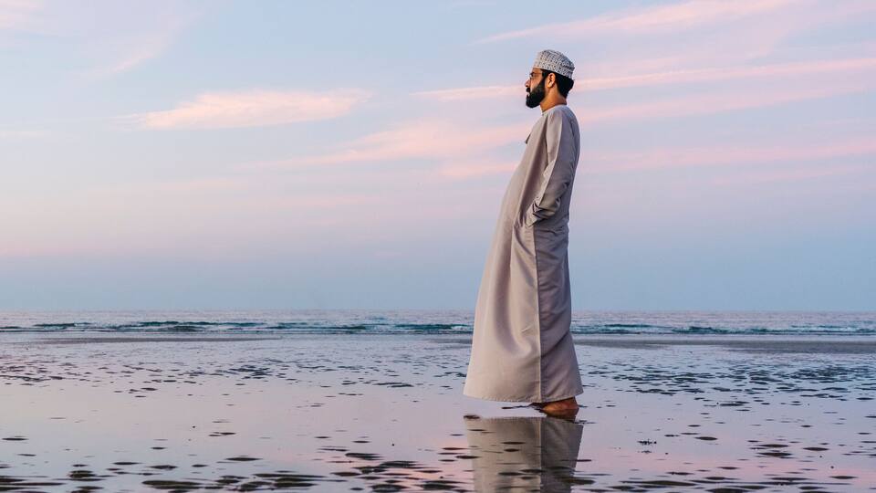 An Arab man on Azaiba beach in Muscat Oman