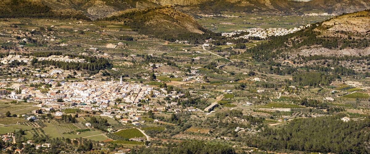 A mountainous landscape with a town nestled in the valley.