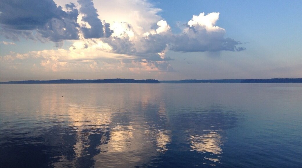 Vashon Island on the left, Blake Island on the right. Blake is a state park, accessible only by boat. Small marina, mooring balls and a private commercial ferry provide access. Hiking trails, camp sites, and very friendly deer.