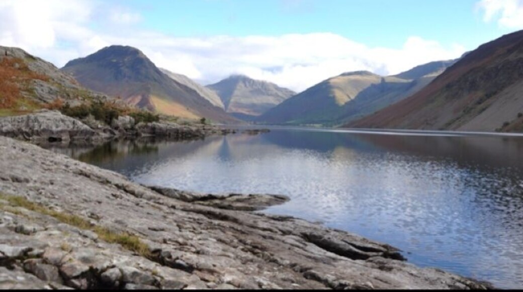The view of Wastwater in the Lake District. It is England's deepest lake and is surrounded by mountains like Scafell Pike, England's highest mountain.