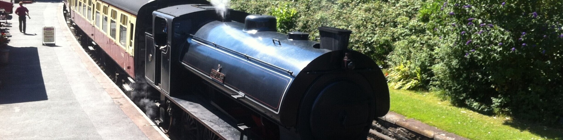 Steam train departing station