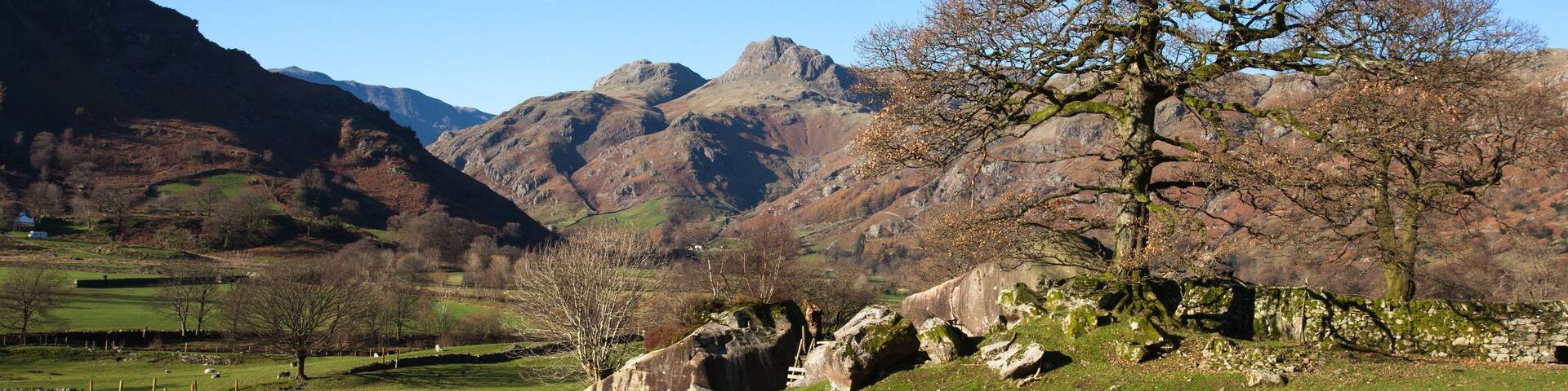 The Langdale Boulders at Chapel Stile, Ambleside with the Langdale Pikes in the background, taken on a very bright clear November day