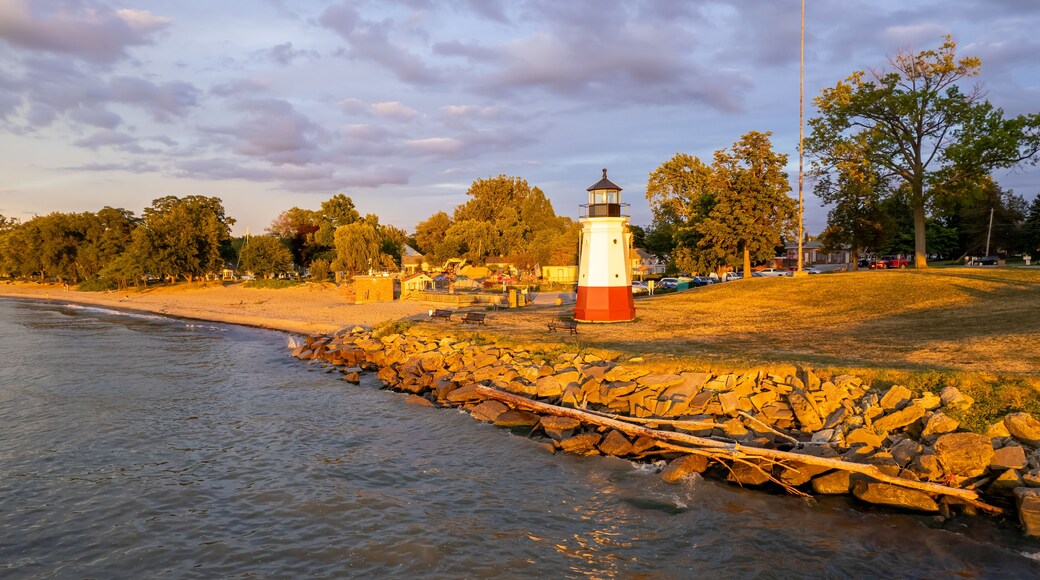 Historic Vermilion Lighthouse at harbor view state park in Vermilion city Ohio in twilight.