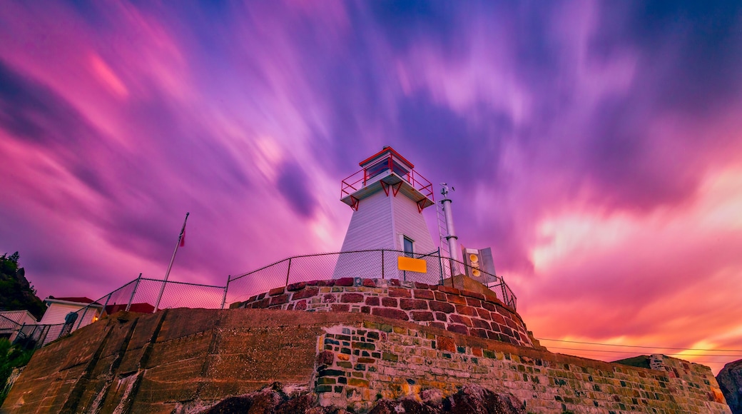 Fort Amherst Lighthouse at St John, Newfoundland, Canada with burned sunset sky as background