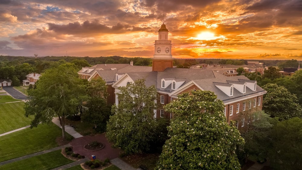 Aerial view of Virginia Hall, central building of Virginia State University public historically Black land-grant university in Ettrick with dramatic colorful sunset sky