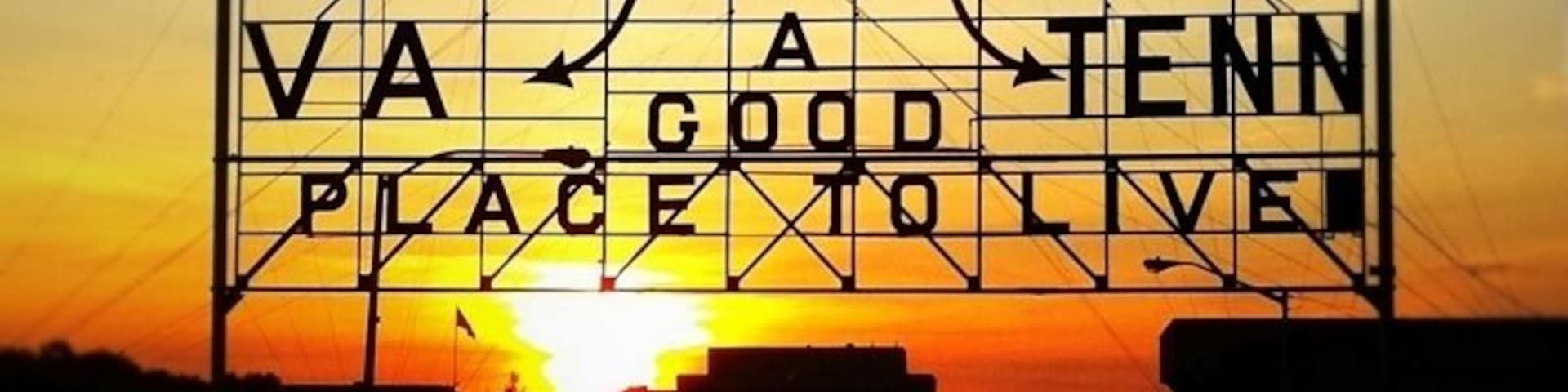 When the Bristol Gas and Electric Company was purchased in 1910 the new owners donated this advertising sign. The “Mammoth Electric Sign”, measuring 60’ wide by 35’ high, was shipped by rail and dedicated on July 4 to a crowd of over 3,000 citizens. For its first five years it was perched on the top of The Interstate Hardware building until it was removed in 1915 to its present location over State Street. The original slogan read, “Push, That’s Bristol”, which was the mantra for the era’s industrial “push” that centered in Bristol. In 1921 the polish of the sign had diminished Bristol’s marketing icon when its lights would flicker “PU” That’s Bristol or “SH” that’s Bristol, and a citywide campaign chose its current slogan. In 1988 it was accepted to the National Register of Historical Places.
In 2010 this enormous structure, the Bristol Slogan Sign, marked its 100th year on the eastern end of downtown Bristol, itself straddling State Street. It has been a part of community pride and the one structure in the city that has identified Bristol’s common purpose and heritage. The message on this sign has been the marketing slogan for the city for close to 90 of those years, and considered one of the oldest community slogans in the United States. It reads, “Bristol Va – Tenn, A Good Place To Live”.