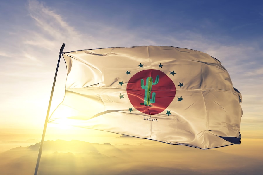 Zacapa department of Guatemala flag waving on the top sunrise mist fog