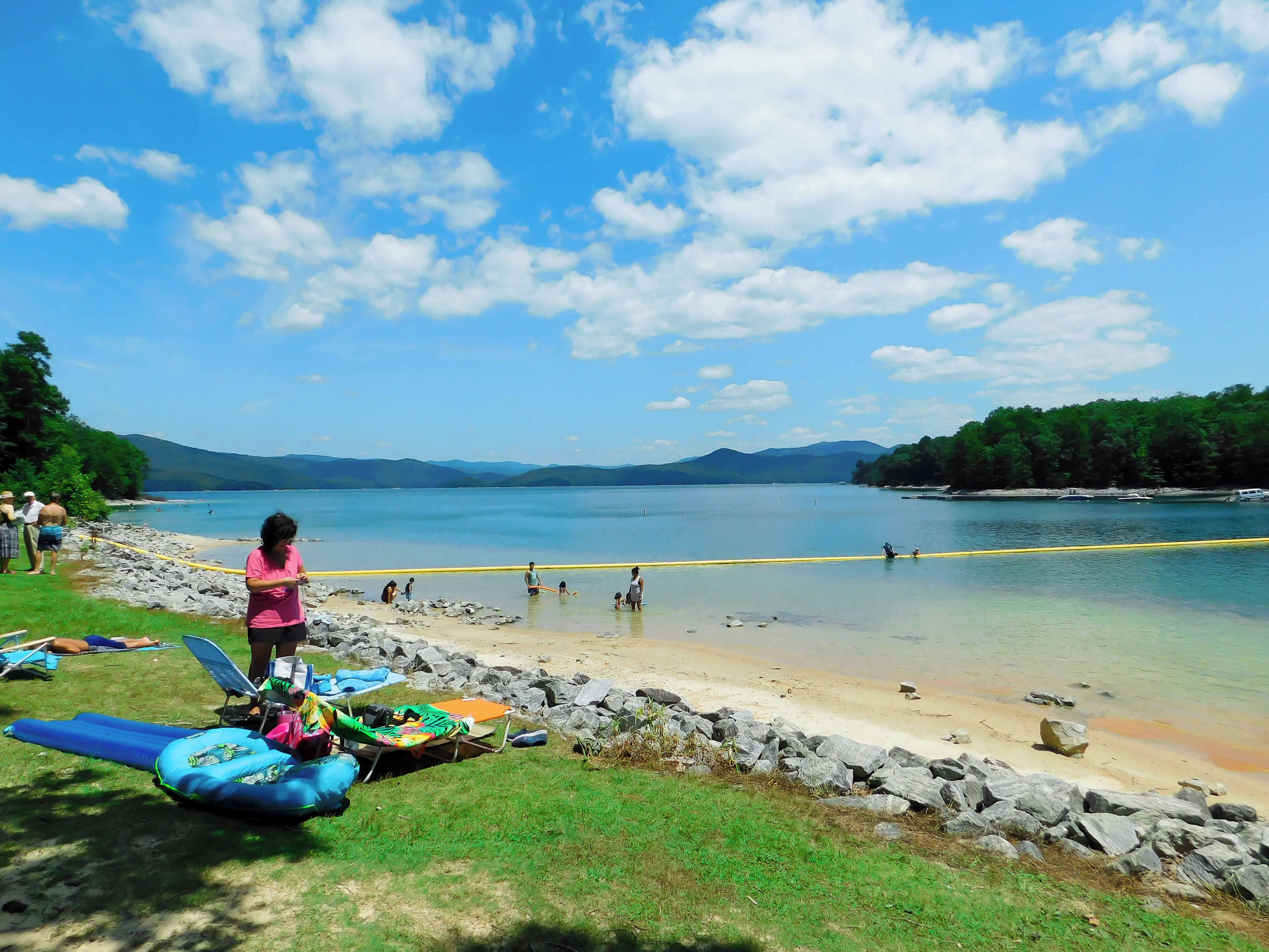 Lake Jocassee, the gorgeous blue heart of the Jocassee Gorges, is actually a man-made lake. It was created when the Jocassee Dam was built in 1973. ... flooding the town.  Attakulla Lodge, an old hotel, is still standing at the bottom of Lake Jocassee, under 300 feet of water. You can  dive here and see a gas station and the cemetery.