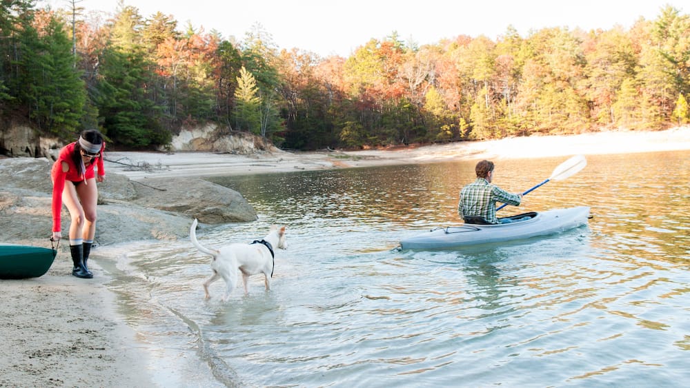 Couple kayaking in remote lake