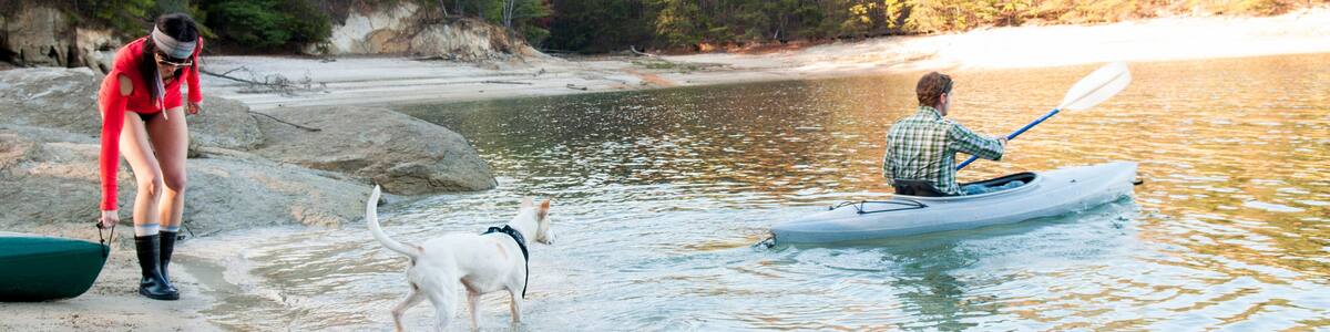 Couple kayaking in remote lake