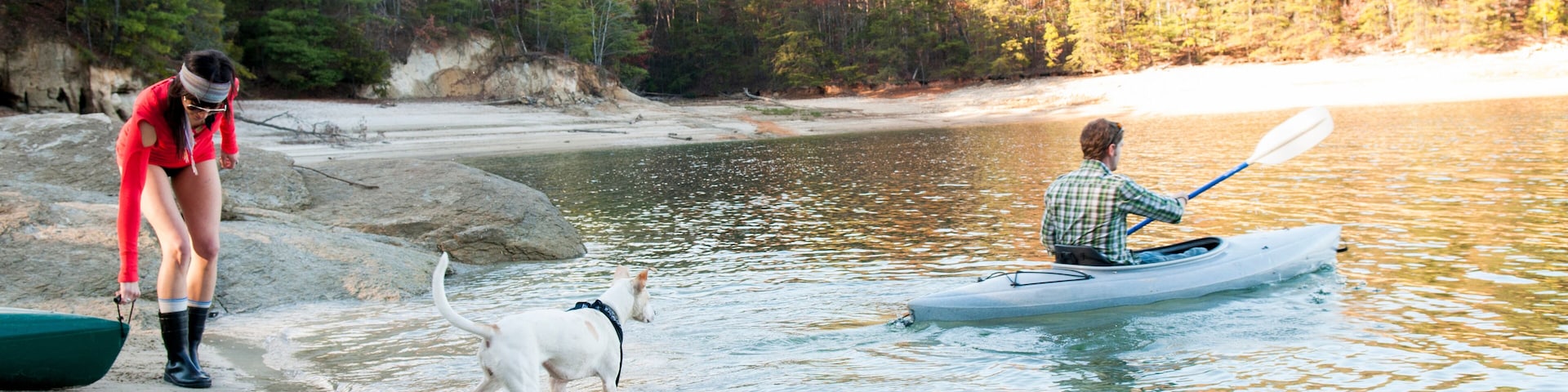 Couple kayaking in remote lake
