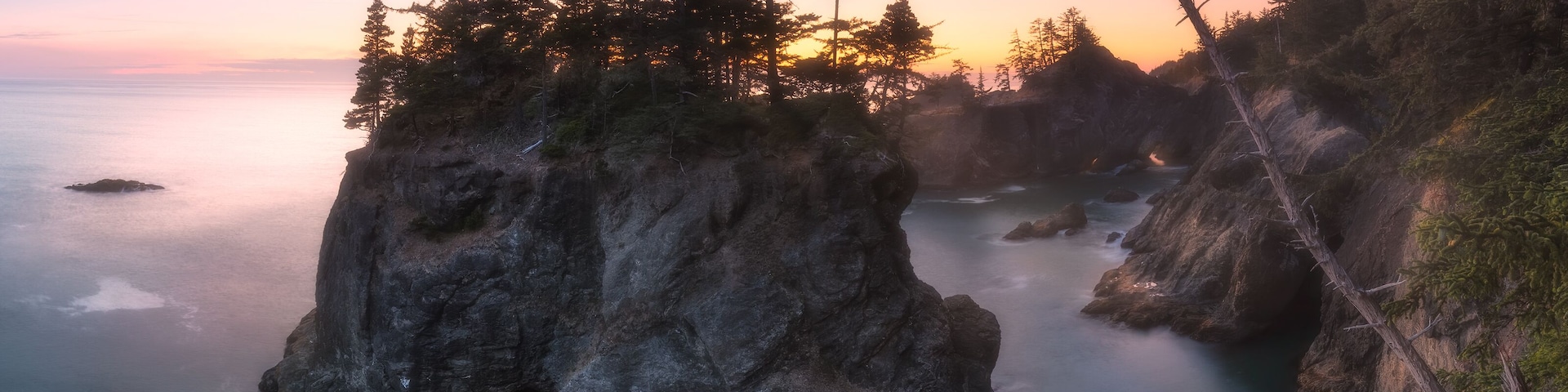 This photo was shot at Samuel H. Boardman State Scenic Corridor on the southern Oregon coast. We took a "trail" from Natural Bridges Viewpoint. There was no sing, and I was frustrated a little bit. But I really wanted to see the beautiful view. So I was able to manage to get there. (Please be careful to take trails around there if you go.) I was waiting for the right moment to shoot. Then the light from the sun burst beautifully in the sky. It was a breathtaking moment.
#Adventure #oregoncoast #Oregon #haystackrock #sunset #samuelhboardman #explore