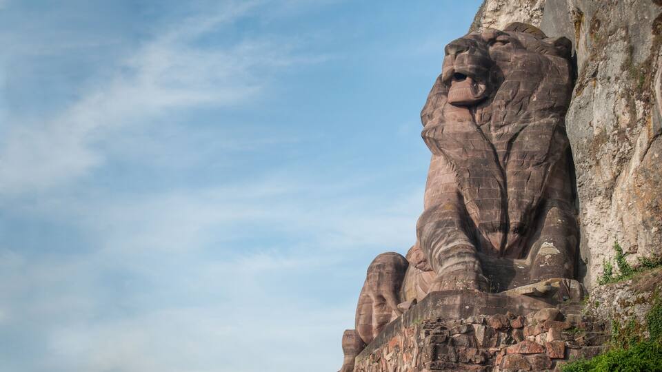 A large rock formation resembling a lion's head.