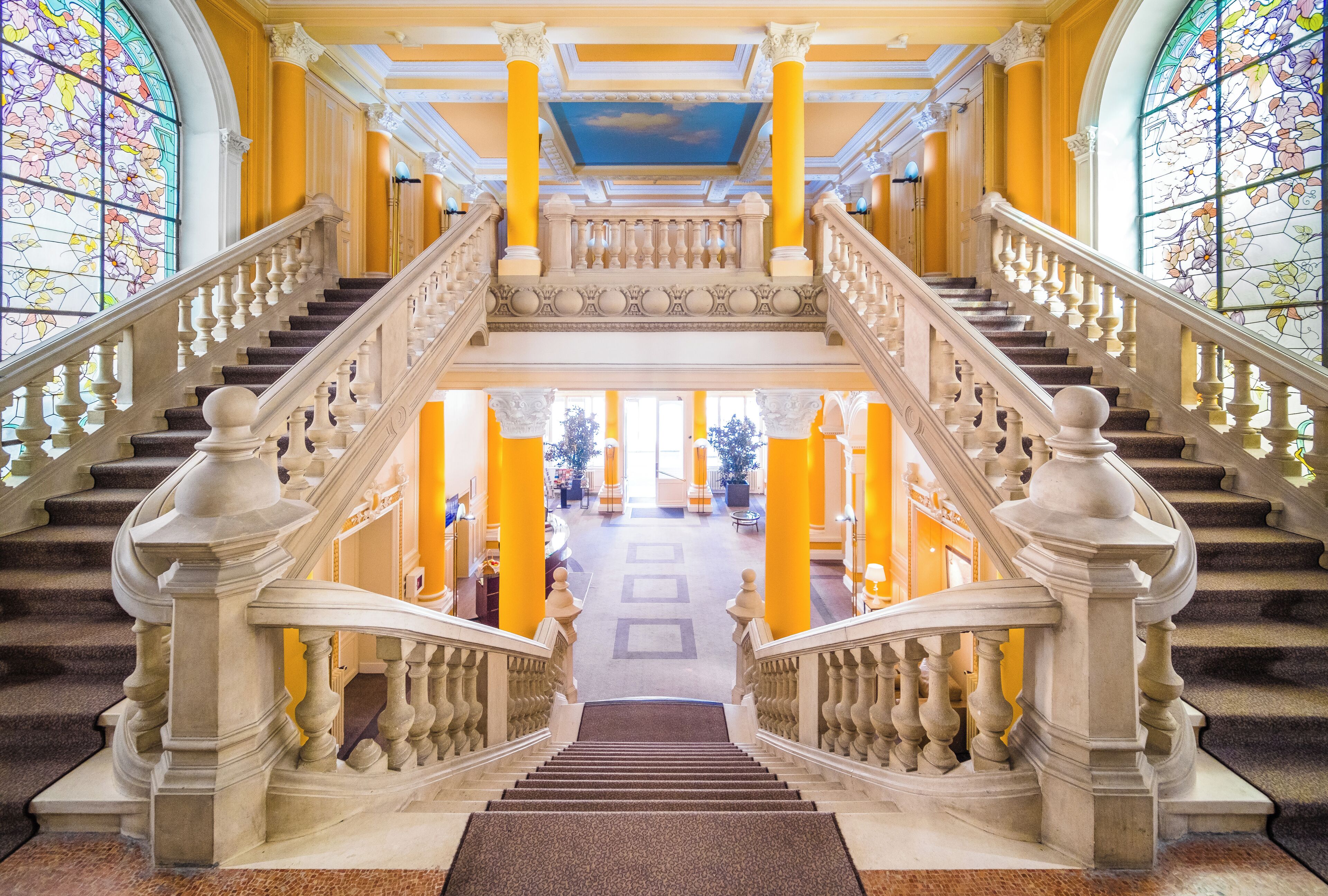 Built in 1907 in neo classical style, the main entrance staircase and the stained glass windows are a must see.