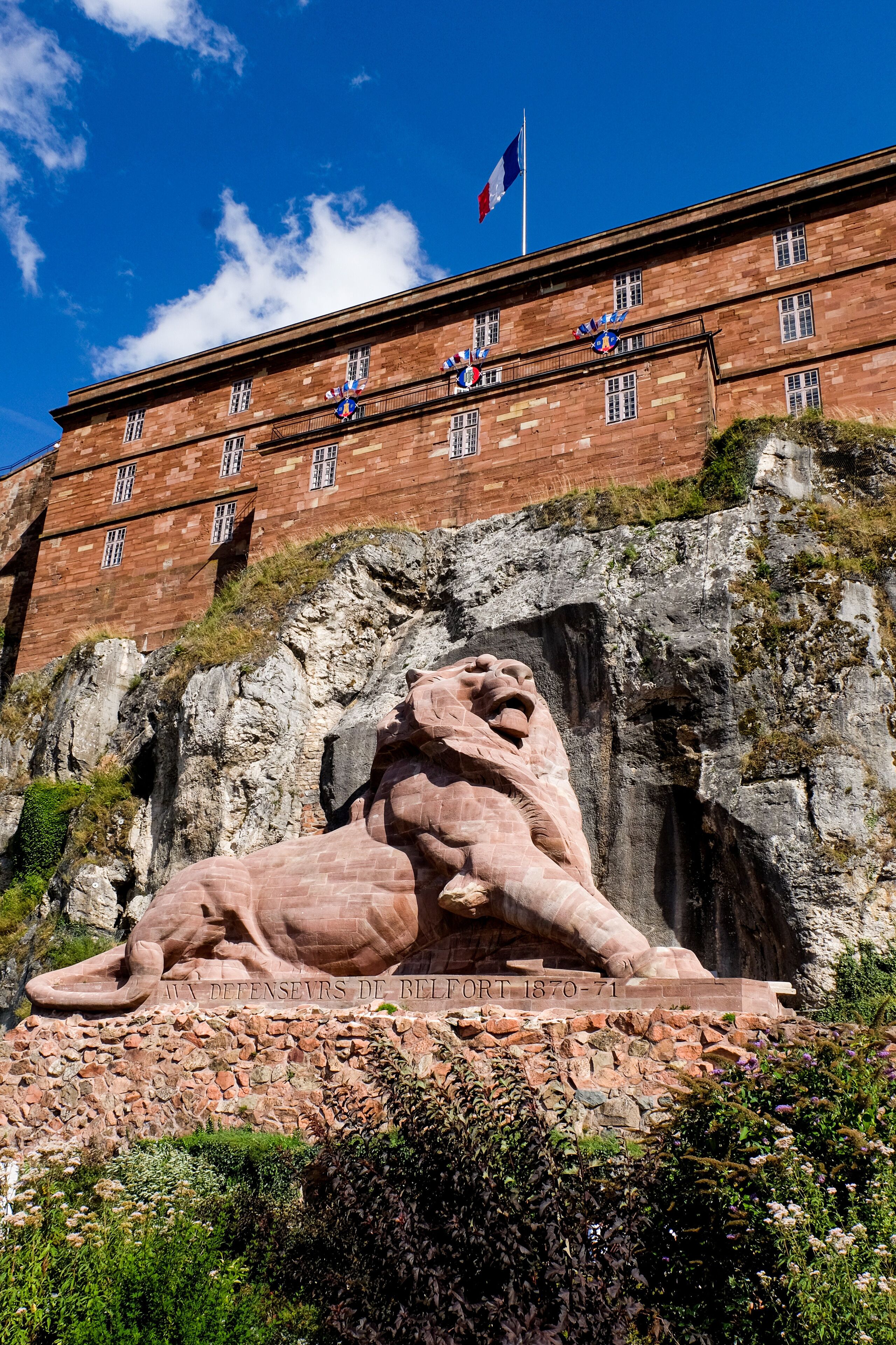 Overlooking the City of Belfort is the famous Lion. It is a monumental sculpture 
of 22 metres long and 11 metres high by Frédéric Auguste Bartholdi, sculptor of the Statue of Liberty,
The lion symbolizes the heroic French resistance during the Siege of Belfort, a 103-day Prussian assault from December 1870 to February 1871. 