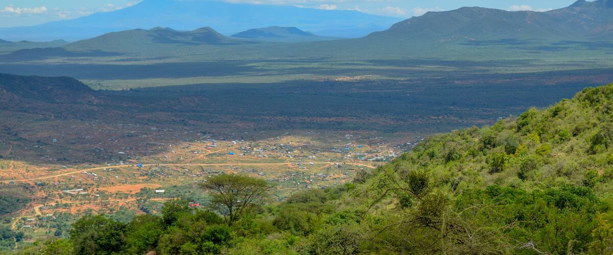 A mountainous landscape with a valley town.